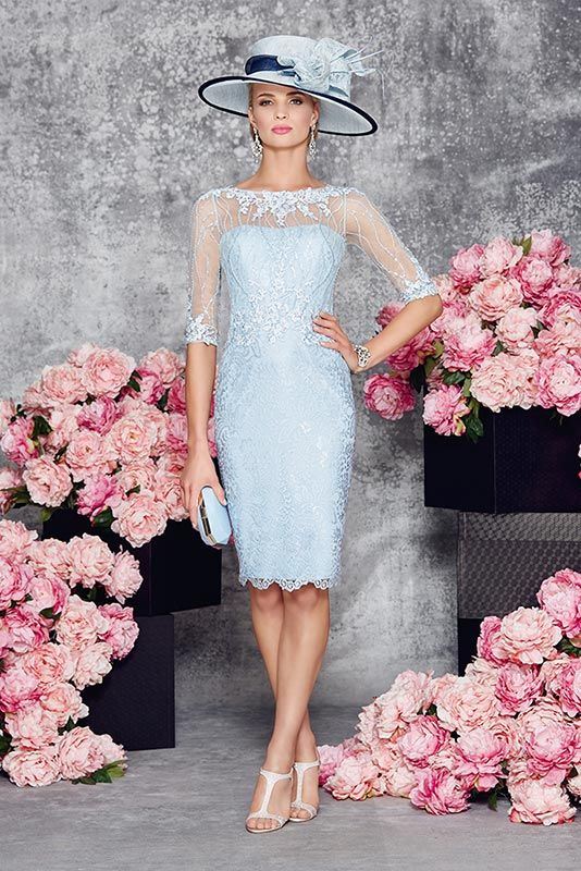 a formal light blue lace sheath knee dress with an illusion neckline and sheer sleeves plus a statement hat with a bow