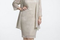 a simple embellished combo of a knee dress and a cardigan, metallic shoes and an embellished necklace