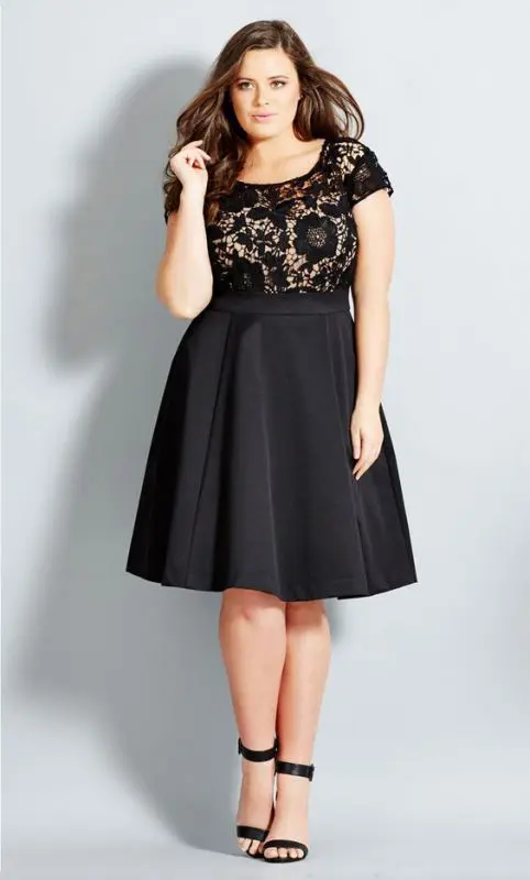 a black knee dress with a lace bodice, short sleeves, a pleated skirt and black heels for a timeless look