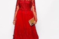 a bold red lace midi dress with a bateau neckline and long sleeves is ideal for a holiday wedding