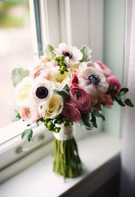 a pretty wedding bouquet of white anemones, pinka nd blush ranunculus and greenery will be a nice idea for a spring or summer wedding