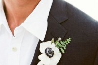 a white anemone boutonniere with a touch of fern is a catchy idea for a woodland wedding