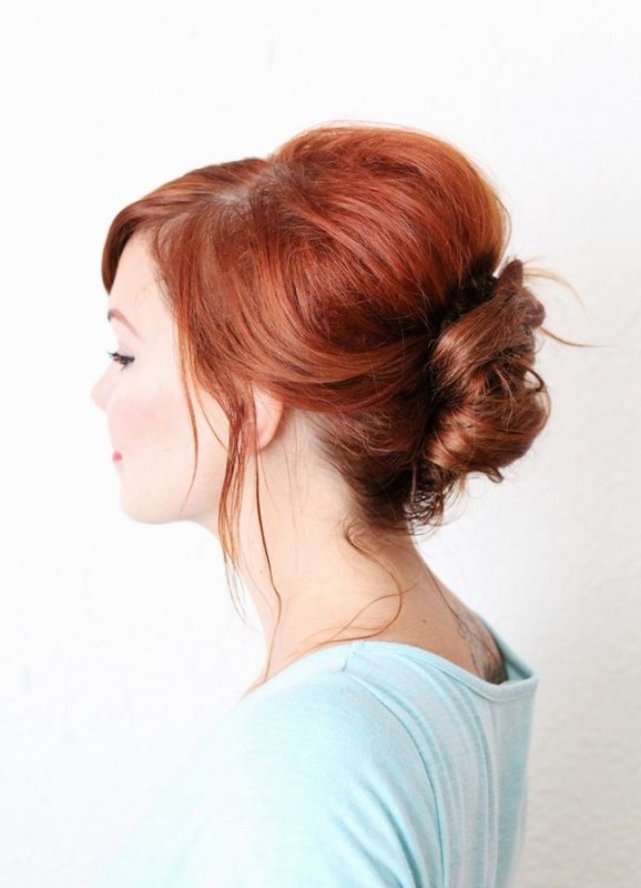 a messy French twist updo with a messy volume on top with locks down looks sepctacular and cool on red hair
