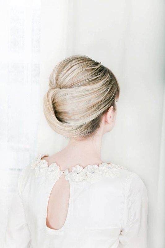 a sweet and tight French twist updo with a volume on top on balayage hair is very stylish and chic