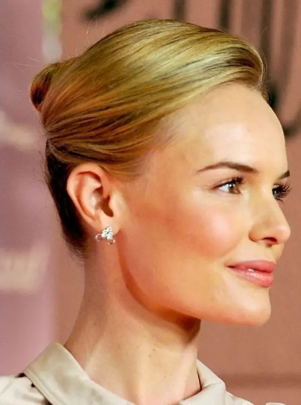 a stylish high French twist updo with side parting and a sleek wavy top is a very chic idea for a more formal wedding