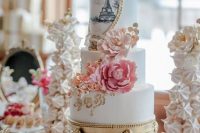 a sweets table with refined sweets for a Parisian bridal shower, with a meringue cake, a painted Eiffel Tower cake is a gorgeous idea