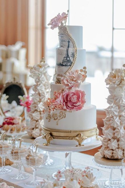 a sweets table with refined sweets for a Parisian bridal shower, with a meringue cake, a painted Eiffel Tower cake is a gorgeous idea