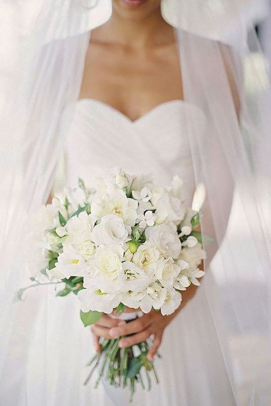 an elegant white wedding bouquet with texture and some greenery is a chic idea for any season