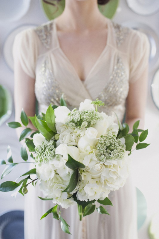 white roses, hydrangeas, smaller blooms and greenery for an elegant and beautiful bridal bouquet