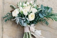white peonies, pale and usual greenery and neutral ribbons for an airy and breezy wedding bouquet