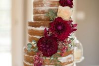 a naked wedding cake decorated with burgundy dahlias, blush roses and some greenery is a gorgeous idea for a summer or fall wedding