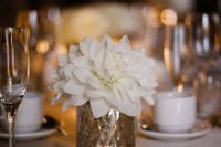 a delicate centerpiece of a gold vase and a creamy dahlia is a cool idea for any neutral wedding in any season