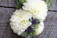 a large neutral dahlia wedding boutonniere of white blooms, thistles and a bit of greenery for any neutral wedding