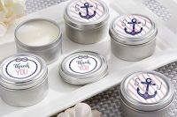 homemade candles in tin cans with anchor stickers are an easy and cool favor idea for a nautical bridal shower