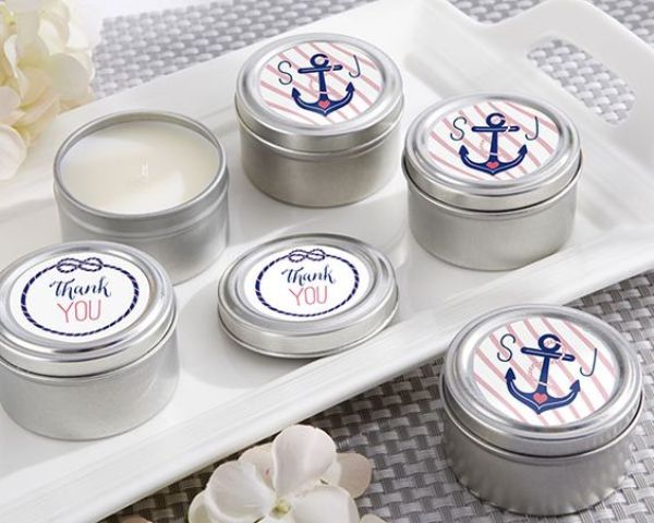 homemade candles in tin cans with anchor stickers are an easy and cool favor idea for a nautical bridal shower