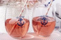 simple glasses with nautical decor and striped straws that match the drinks