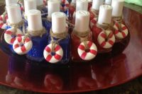 blue and red nail polish with tiny and colorful life savers that add a cool nautical feel to the favors