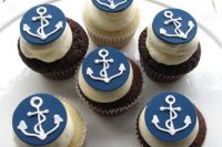 vanilla and chocolate cupcakes with anchor toppers are a great themed treat for a nautical bridal shower