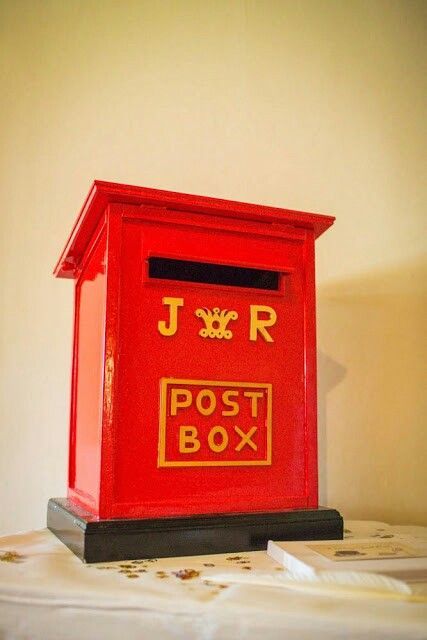 a vintage red and gold mailbox is a cool and stylish idea, add your monograms and go ahead