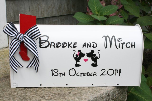 a white mailbox with a little flag, the names and Mickey and Minnie for a Disney themed wedding