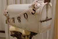 a neutral shabby chic mailbox decorated with a bunting and fabric blooms plus pearls is a very cool idea