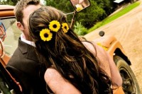 accent your wedding hairstyle with pretty sunflowers to make it look bright and very cozy