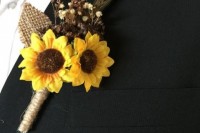 a rustic wedding boutonniere of sunflowers, burlap and some neutral blooms and a feather