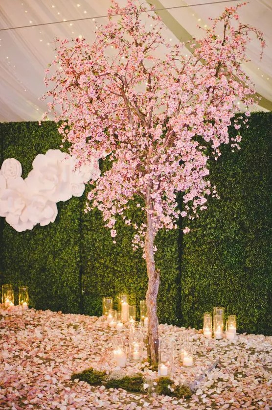 a blooming cherry tree, petals on the floor and candles will make your ceremony or reception space extremely romantic