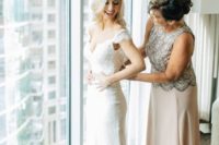 a blush sleeveless maxi dress with a heavily embellished bodice in silver is a glam and bold idea