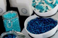 a candy bar with turquoise, navy candies and blue and white jelly candies is a cool and simple idea for a nautical bridal shower