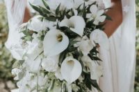 a cascading wedding bouquet with white blooms and callas, with greenery and herbs for a modern tropical bride