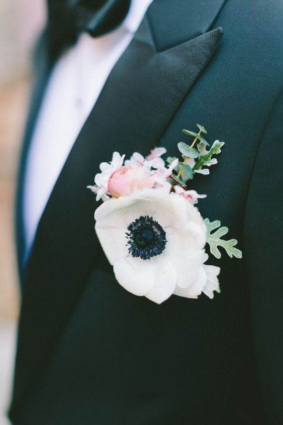 a chic anemone wedding boutonniere with a little pink peony and greenery is a lovely idea for a wedding