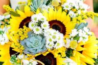 a colorful wedding bouquet of sunflowers, white blooms, succulents and some cascading greenery