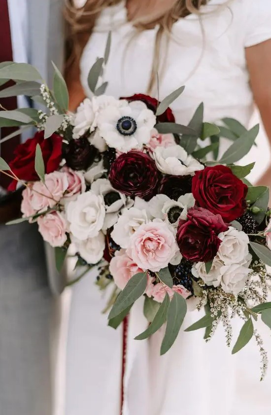 a contrasting wedding bouquet of pink, burgundy and blush roses, white anemones and greenery is a chic idea to rock
