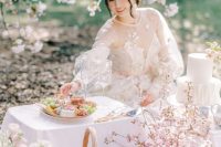 a lovely grazing table with cherry blossoms