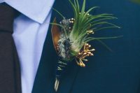 a creative wedding boutonniere of an air plant, gilded seeds and thistles is a lovely accessory for a modern groom