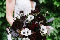 a dark winter wedding bouquet of dark dahlias, white anemones, dark foliage and greenery is a lovely idea for a winter wedding