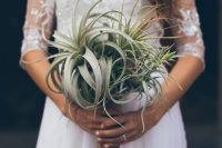 a fully air plant wedding bouquet is a lovely idea for a boho or rustic bride, it’s a lovely idea for a non-floral wedding