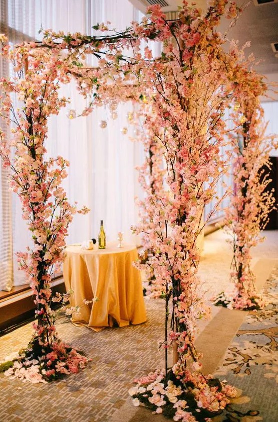 a lush cherry blossom wedding chuppah like this one will instantly bring an outdoor feel even if you are having an indoor wedding