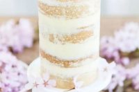 a meringue buttercream, lemon curd and cherry blossom wedding cake is a gorgeous solution for spring