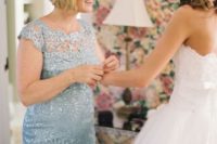 a powder blue lace dress with cap sleeves, a high neckline and a touch of sparkle is chic