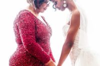 a red sequin fitting gown with long sleeves is a chic and shiny option to wear to your daughter’s wedding