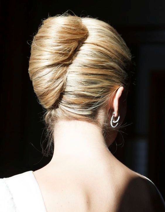 a sleek and super tight French twist idea is ideal for a formal wedding