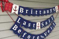 a stylish nautical banner in navy, red and white, with anchors and letters can be easily DIYed for decor