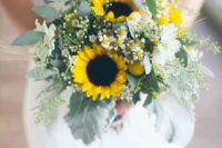 a stylish wedding bouquet of white blooms, sunflowers and textural greenery for a spring or summer bride
