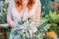a super textural wedding bouquet of greenery, thistles, succulents and some air plants is amazing for a boho bride
