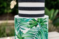 a tropical bridal shower cake with leaves, stripes, a gilded sugar pineapple and a pink rose
