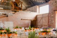 a wedding centerpiece made of potted greenery in copper pots and candles in jars is a cool idea