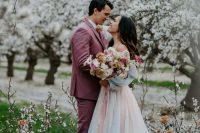 a white cherry blossom orchard and a wedding altar of cherry blossom and bright blooms for a gorgeous spring wedding