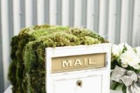 a wooden mailbox with moss on top, with a name with wire for a woodland wedding – use it for anything you want